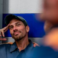 student with a hat on smiling